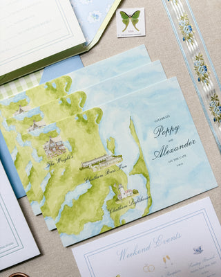 Coastal chic watercolor wedding invitation with decorative elements on a textured surface